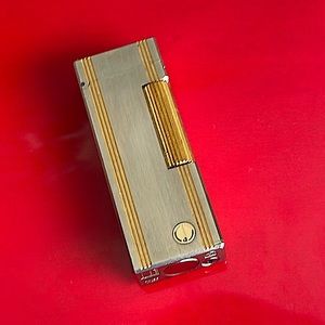 Dunhill rollagas lighter-silver/gold lines print-great working cond.
